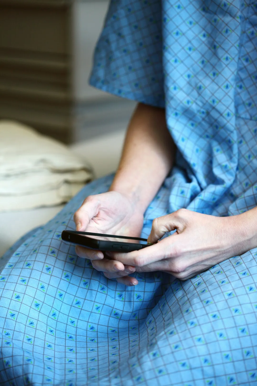 A patient calling their healthcare provider on a smartphone