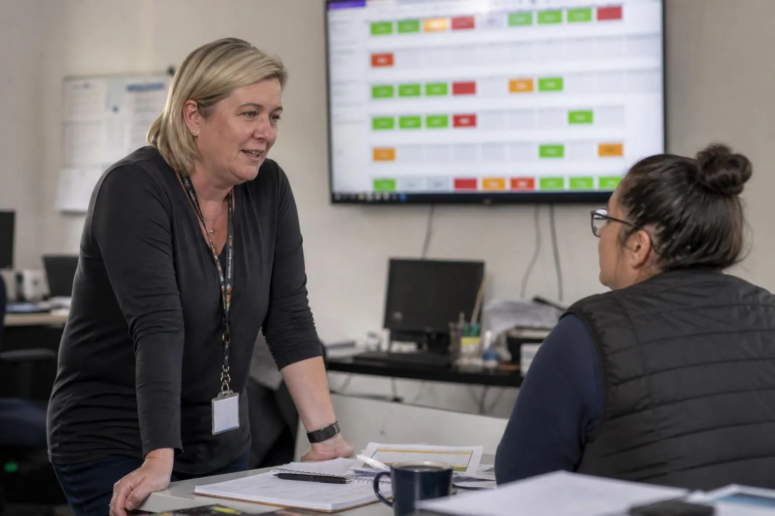 An operations lead reviews live call activity across clinic locations on a dashboard screen
